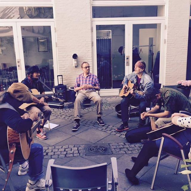 group of songwriters in the copenhagen retreat sharing music